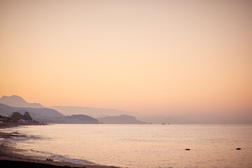 Fototapeta premium Wonderful landscape of sunrise beach with mountains and Mediterranean Sea