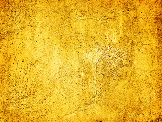 Golden Background. Old gold. Embossing technique. Golden wallpaper. Yellow texture.