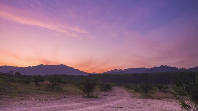 4K Timelapse beautiful sunrise landscape warm weather pink-orange color sky, cirrus clouds sprayed over wide space in the morning, skyscape nature background in the spring season. pastel color texture