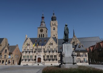 Fototapeta na wymiar City hall Belfry and Sint-Niklaas church in Diksmuide West Flanders Belgium