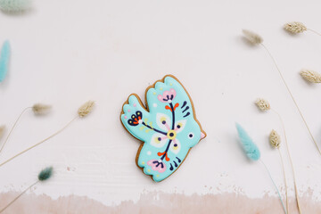 Easter gingerbread cookie on white background, top view
