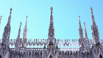 Fototapeta na wymiar Milan , Italy march 2021 - spiers of the cathedral ( Duomo ) in a sunny day with blue sky during covid-19 Coronavirus lockdown quarantine home 