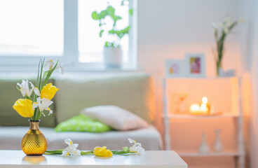 white home interior with spring flowers and decorations