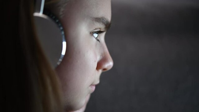 Caucasian Girl with Headphones Listening Music Profile Close Up
