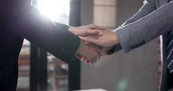 Business people shake hands when reaching future commercial and investment goals.
