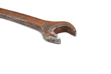 Rusty wrench on white background close-up. Tool, old, rare, vintage