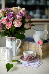 still-life with vintage white ware and pastel roses