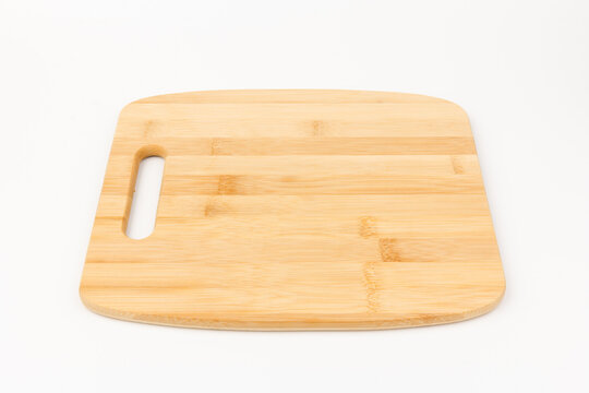 Top view high quality wood cutting board, brown wood. Chopping boards made from natural bamboo. Isolated image kitchen utensil on white background.