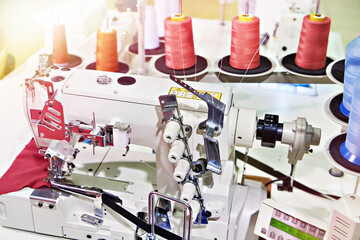 Spools of thread and sewing coverstitch machine