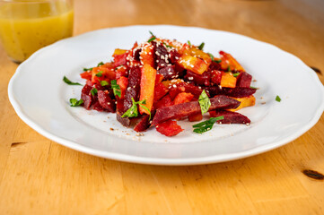 Vegetable french fries from sweet potato, pumpkin, beetroot and sesame seeds