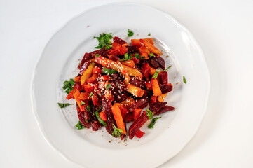 Vegetable french fries from sweet potato, pumpkin, beetroot, sesame seeds and green parsley.