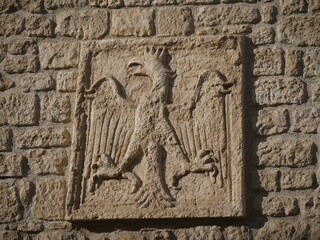 San Marino, Porta San Francesco is the entrance to the old town in the walls. Closeup on the graffito indicating the statutes in force at the time of construction.