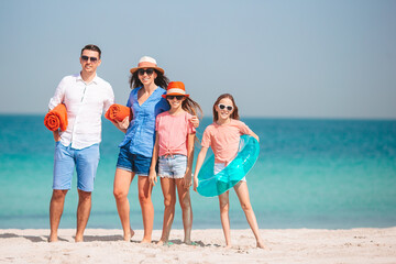 Happy family on the beach during summer vacation