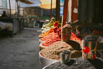 Osh, Kyrgyzstan - 10.09.2019: Local food and spices in Osh bazar, the main market in Bishkek. Photo with copy space