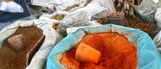 Osh, Kyrgyzstan - 10.09.2019: Local food and spices in Osh bazar, the main market in Bishkek. Photo with copy space