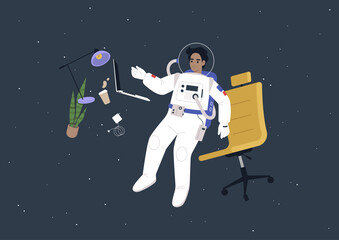 A young male astronaut in a spacesuit working on their laptop in outer space, a futuristic life concept © nadia_snopek
