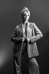 Sexy young blonde, a jacket dressed on a naked body. A detached look a little to the side.