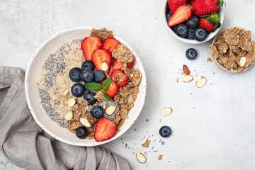 Bowl of fresh homemade oatmeal porridge with berries. Healthy food for Breakfast.