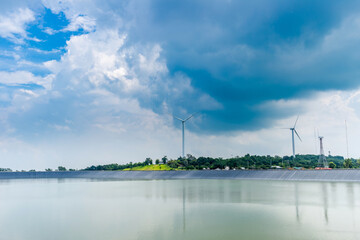 Lam Takong Reservoir view, water reservoir with black plastic liner and Wind turbine at Sikhio, Nakhon Ratchasima, Thailand.