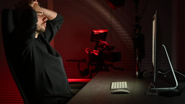 Tired and Frustrated Caucasian Trader in His 40s in Front of His Computer During Night Hours.