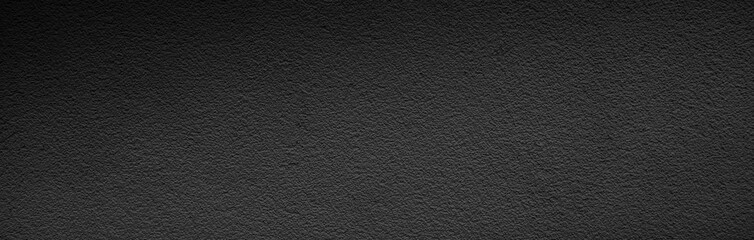 Banner of black asphalt texture. Wide black textured background. Shiny glossy dark panoramic surface