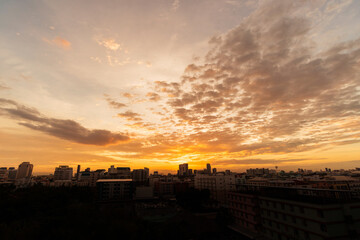 Fototapeta premium Golden light of the sunset over the city.