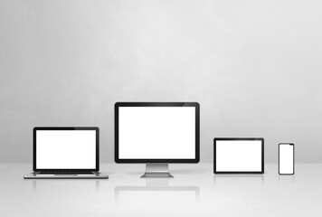 computer, laptop, mobile phone and digital tablet pc. white concrete background