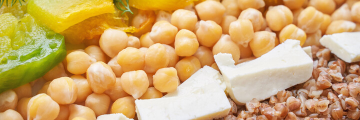 Food bowl with chickpeaks. Health dinner. Vegetarian cooking cuisine. Cafe organic meal. Fresh lunch with pumpkin and feta cheese. Detox spicy. Above view. Flatlay. Closeup. Banner