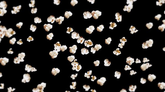 Flying many popcorns on black background. White salty popcorn. Healthy food. Corn seed. 3D loop animation of popcorn rotating.
