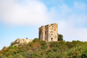 View of old ruin Arnstein castle with greenery under a cloudy sky in Saxony-Anhalt, Germany