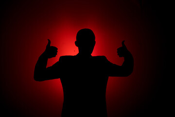 Silhouette of a man on a red background.