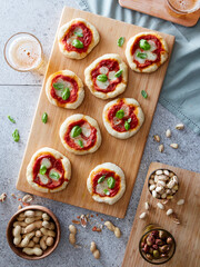 small tomato and cheese pizza appetizer with beer 