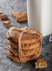 Oatmeal cookies with milk. Oatmeal cookies in a bundle with milk in the background