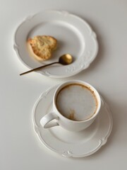 Morning breakfast with cup of coffee and biscuits in the background pink flower tulips
