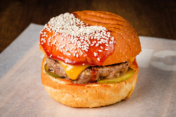 western style bacon burger with onion rings and bbq sauce