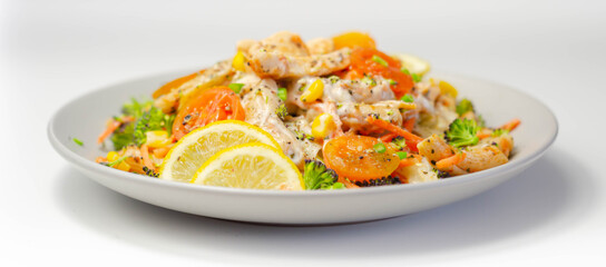 Piri piri style chicken on a bed of wholewheat pasta and vegetables, with a cool sour cream and chive dressing