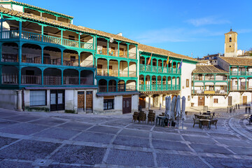 Central square of the town of Chinchon in Madrid, typical houses with wooden balconies and an old...