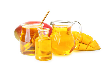 Composition with mango essential oil on white background