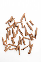 Delicious chocolate curls on white background