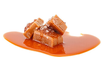 Salted toffee candies with caramel sauce isolated on a white background. Salted caramel pieces. Golden Butterscotch toffee caramels.