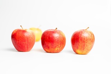 Red and yellow apples on white background