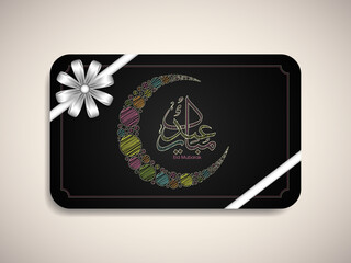 Greeting card design with Arabic Calligraphic text of Eid Mubarak.