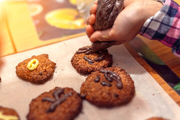 applying the glaze to homemade cookies