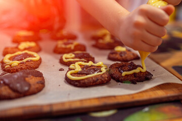 applying the glaze to homemade cookies
