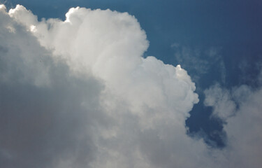 Cumulus clouds against a blue sky