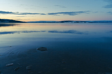 Lake Mjøsa seen from Totenvika Bay toward Helgøya Island in evening.