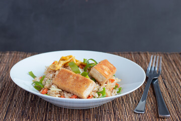 Fried rice with vegetable and tofu in egg and breadcrumbs 