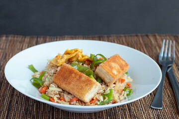 Fried rice with vegetable and tofu in egg and breadcrumbs 