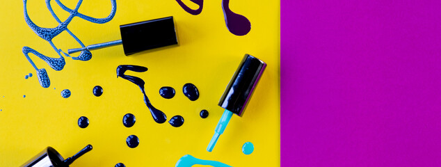 Blots of purple, blue nail polish isolated on bright background.Nail Polish Splashes. art set. Blots of mixed multicolor samples.paint splash isolated on yellow. Web banner.copy space
