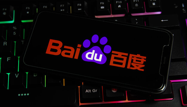 Viersen, Germany - March 1. 2021: Closeup of smartphone with logo lettering of chinese baidu technology internet company on computer keyboard
